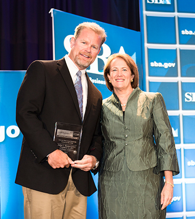 John Stonecipher of Guidance Aviation winning the SBA National Person of the Year award in Washington DC